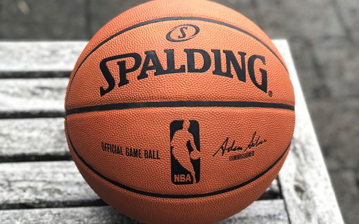 A basketball on a wooden floor